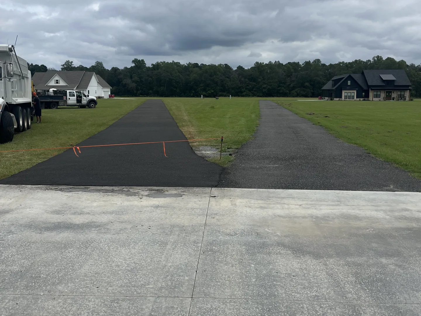 Freshly laid recycled asphalt driveway beside one cured for six months